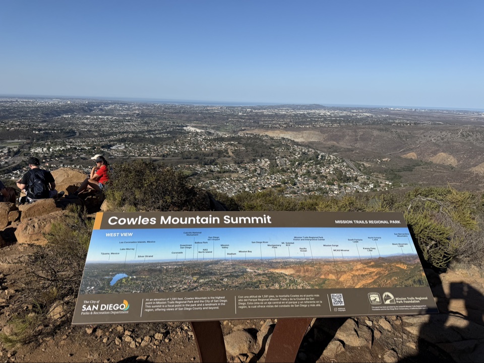The summit marker at 1,591 feet, with the west view beyond